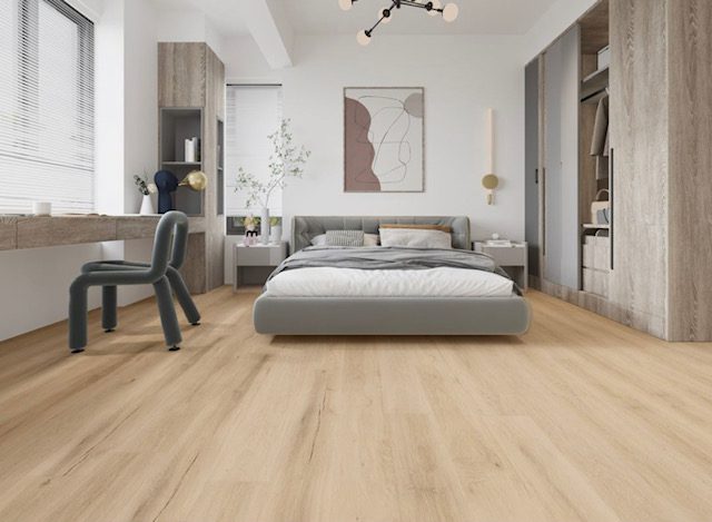 Light brown flooring in bedroom